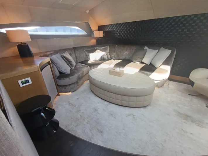 Gamma Yacht Photos Pics Luxurious interior of a 2007 Pershing 115 yacht with plush seating and modern decor.
