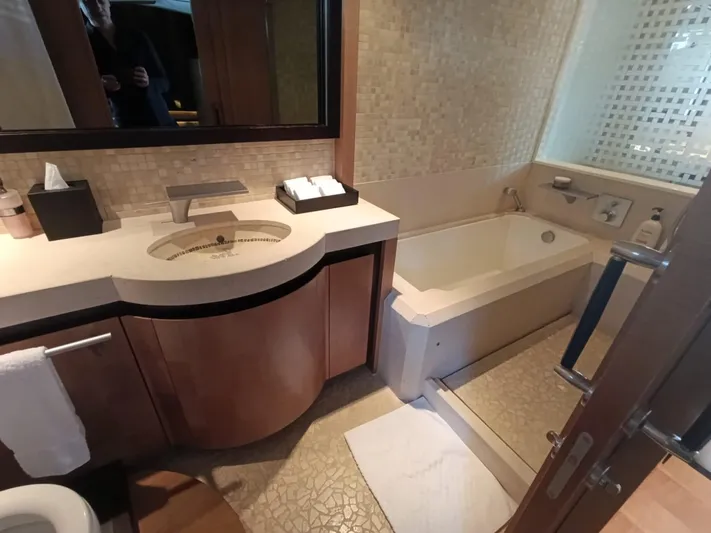 Gamma Yacht Photos Pics Luxurious bathroom in a 2007 Pershing 115 yacht, featuring modern fixtures and elegant design.