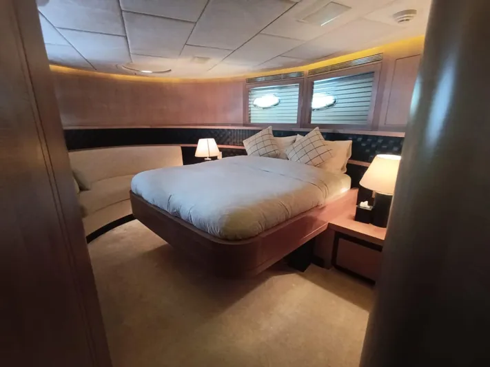 Gamma Yacht Photos Pics Luxurious bedroom interior of 2007 Pershing 115 yacht with elegant lighting and modern furnishings.