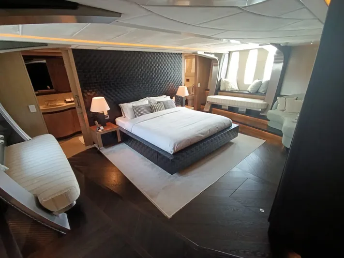 Gamma Yacht Photos Pics Luxurious bedroom interior of a 2007 Pershing 115 yacht with modern furnishings.