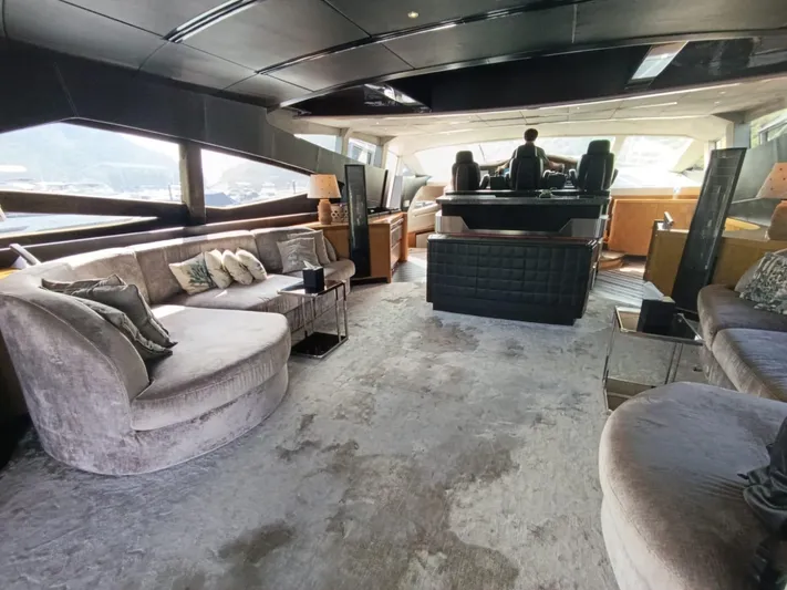 Gamma Yacht Photos Pics Luxurious interior of a 2007 Pershing 115 yacht with plush seating and modern design.