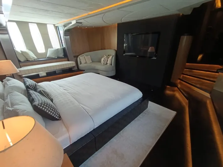 Gamma Yacht Photos Pics Luxurious bedroom interior of 2007 Pershing 115 yacht with modern design and elegant furnishings.