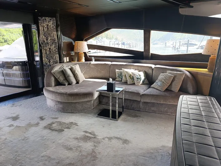 Gamma Yacht Photos Pics Luxurious interior of a 2007 Pershing 115 yacht with plush seating and elegant decor.