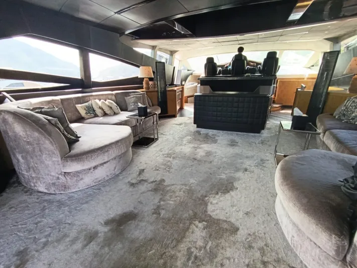 Gamma Yacht Photos Pics Luxurious interior of a 2007 Pershing 115 yacht with plush seating and modern design.