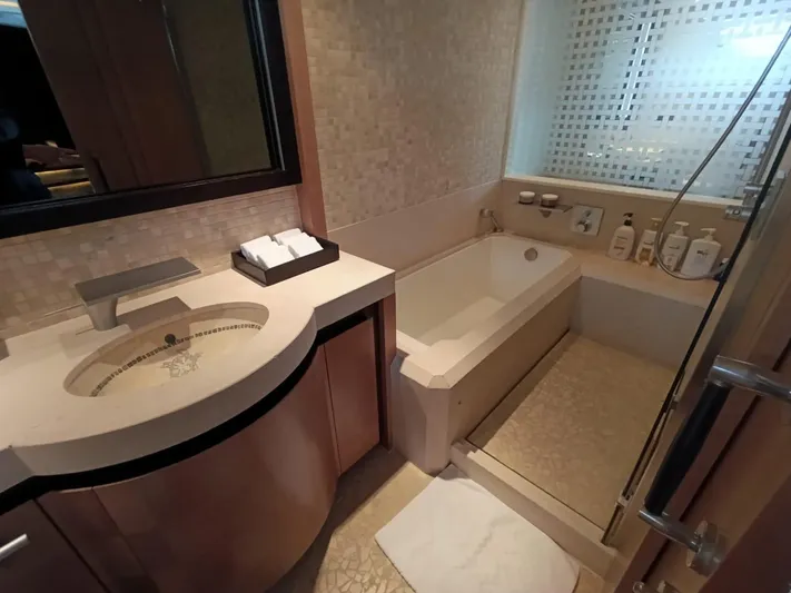 Gamma Yacht Photos Pics Luxurious bathroom in a 2007 Pershing 115 yacht with modern fixtures and elegant design.