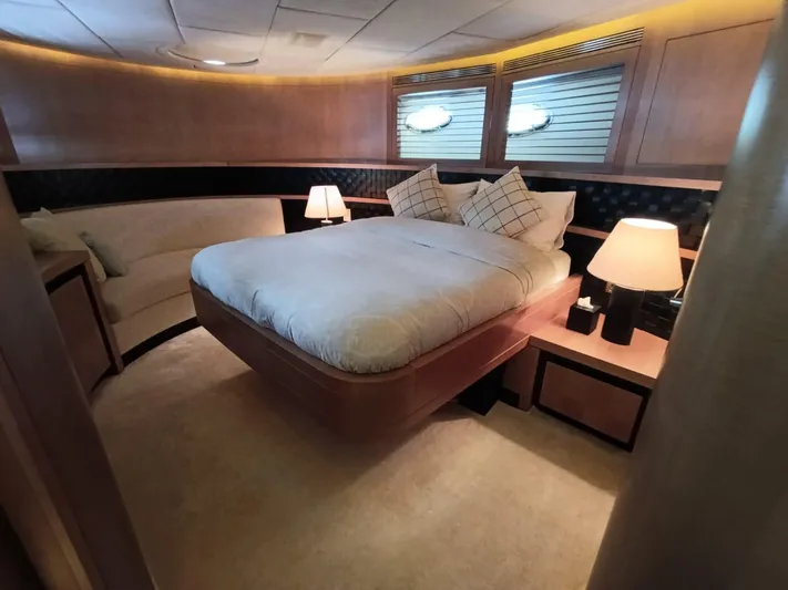 Gamma Yacht Photos Pics Luxurious bedroom interior of 2007 Pershing 115 yacht with elegant lighting and modern furnishings.