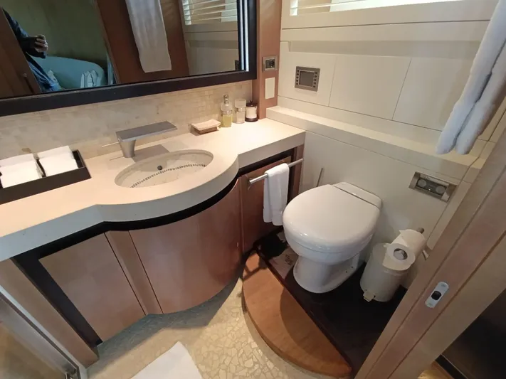 Gamma Yacht Photos Pics Luxurious bathroom in a 2007 Pershing 115 yacht with modern fixtures and elegant design.