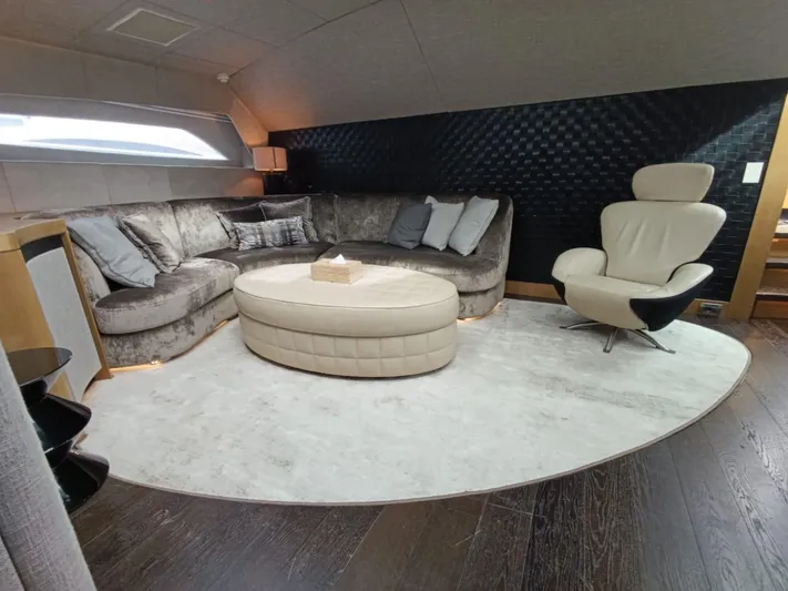 Gamma Yacht Photos Pics Luxurious interior of a 2007 Pershing 115 yacht with modern seating and elegant decor.