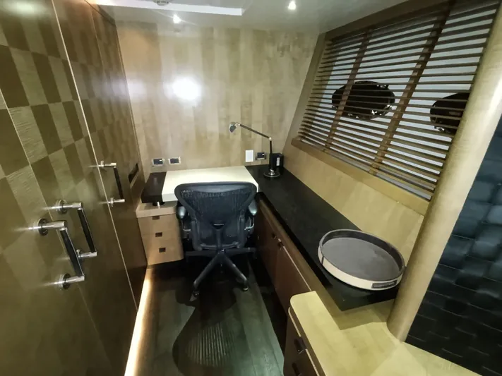 Gamma Yacht Photos Pics Luxurious office space inside a 2007 Pershing 115 yacht, featuring modern furnishings and sleek design.