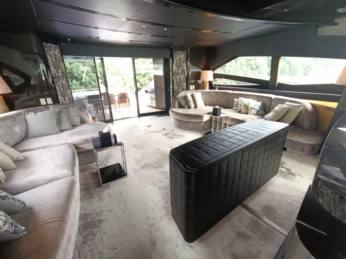 Gamma Yacht Photos Pics Luxurious interior of a 2007 Pershing 115 yacht with elegant seating and modern decor.