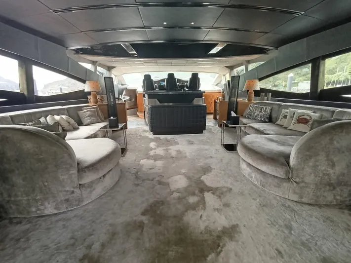 Gamma Yacht Photos Pics Luxurious interior of a 2007 Pershing 115 yacht with plush seating and modern design.