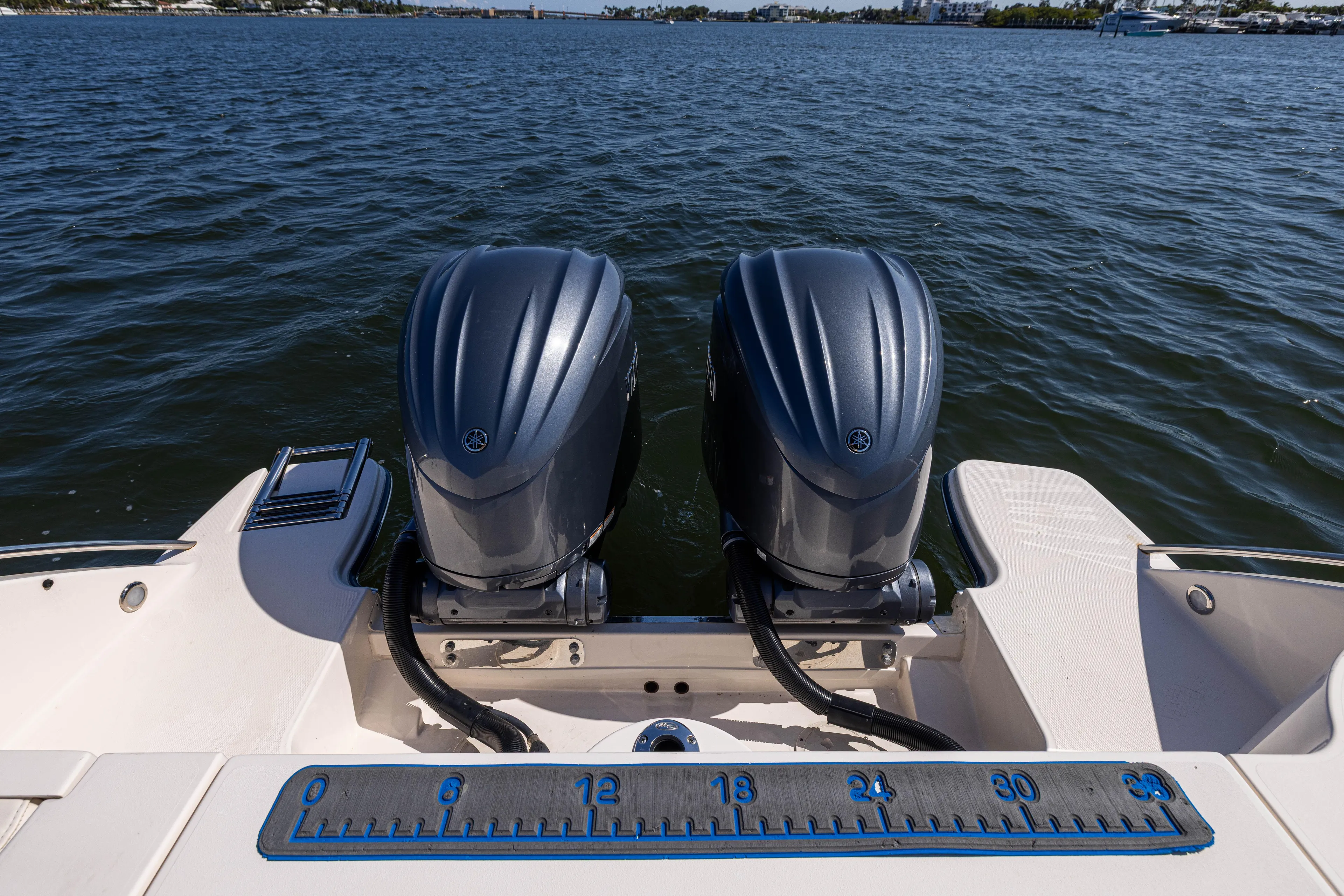 Purple Bags 2 Yacht Photos Pics 2023 Grady-White Canyon 326 boat with dual outboard engines on water.