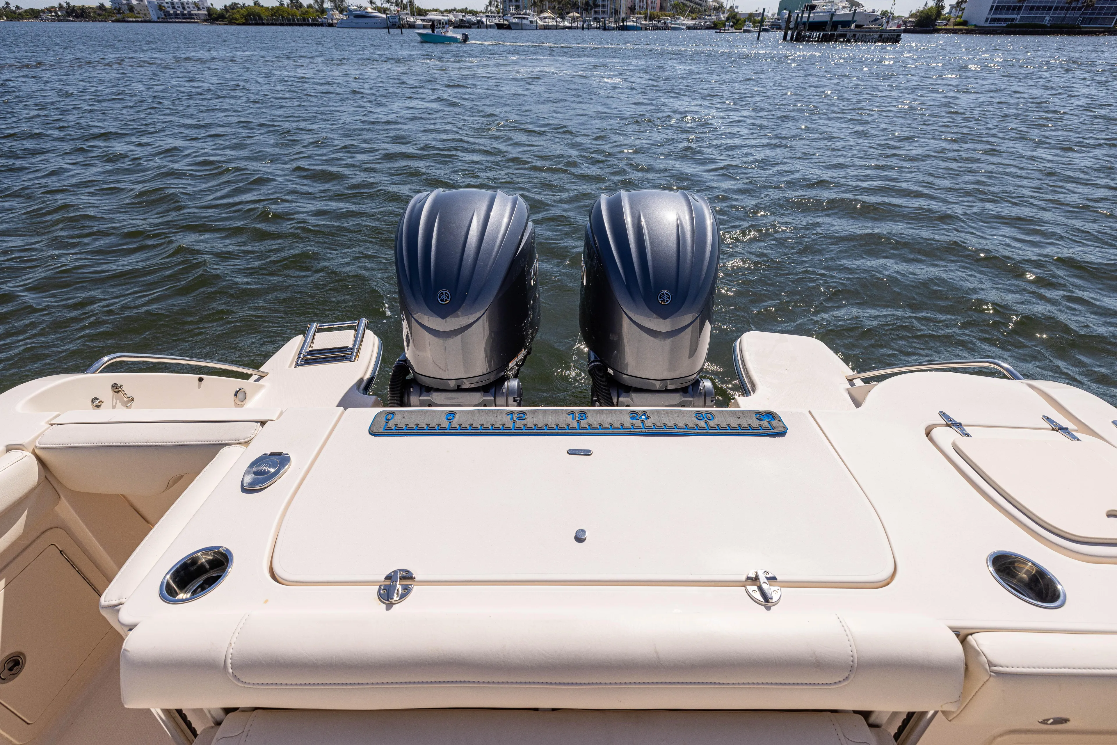 Purple Bags 2 Yacht Photos Pics 2023 Grady-White Canyon 326 boat with dual engines on a sunny day.