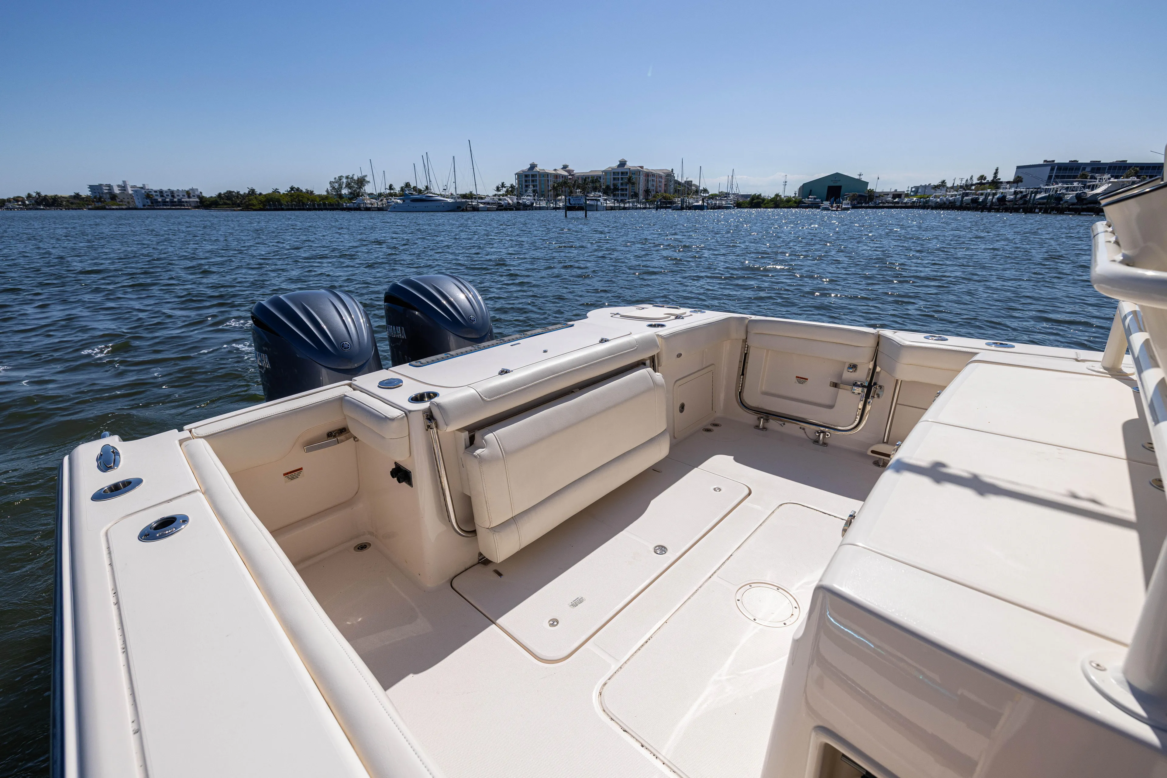 Purple Bags 2 Yacht Photos Pics 2023 Grady-White Canyon 326 boat with dual engines on calm water.