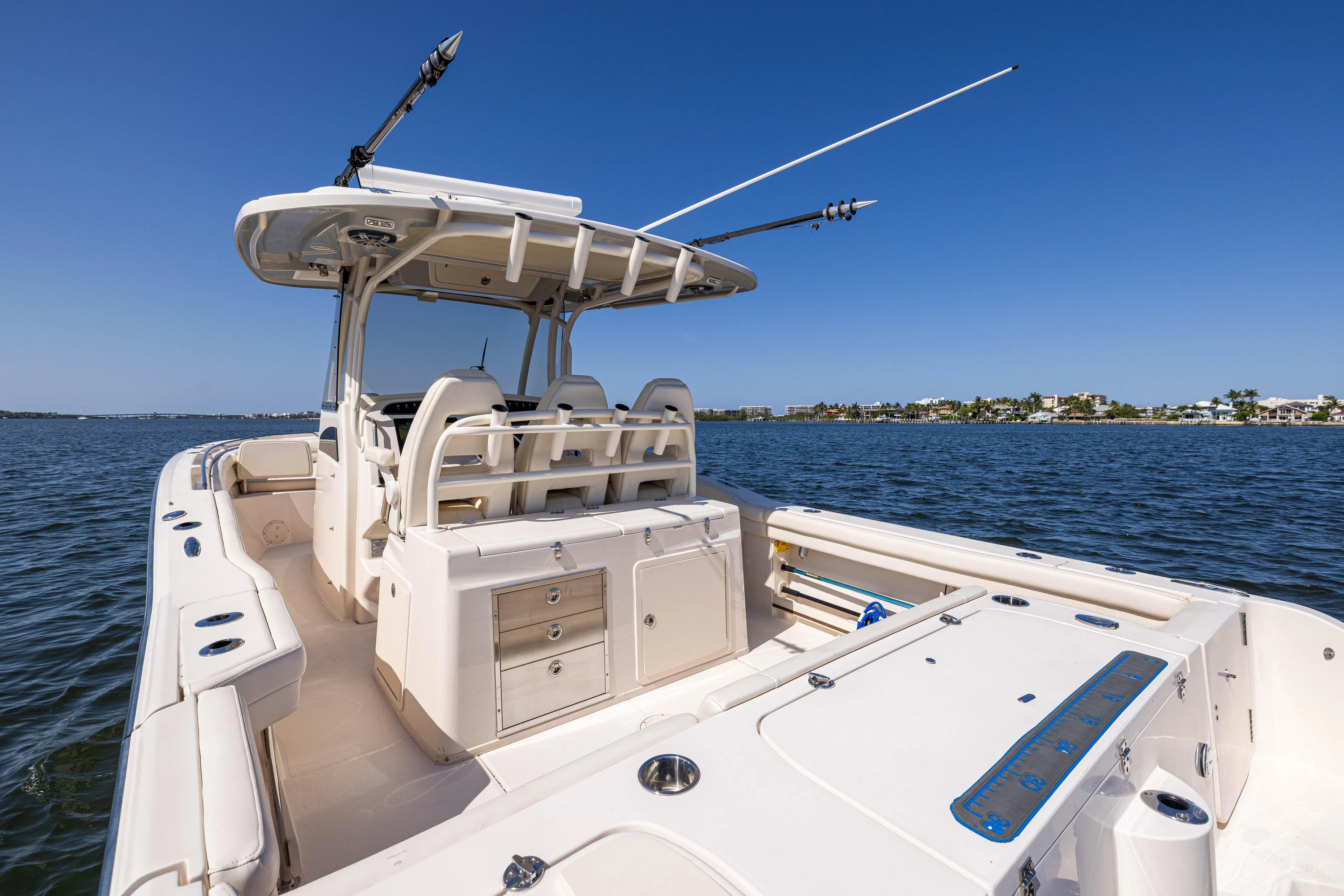 Purple Bags 2 Yacht Photos Pics 2023 Grady-White Canyon 326 boat on water, featuring spacious deck and seating.