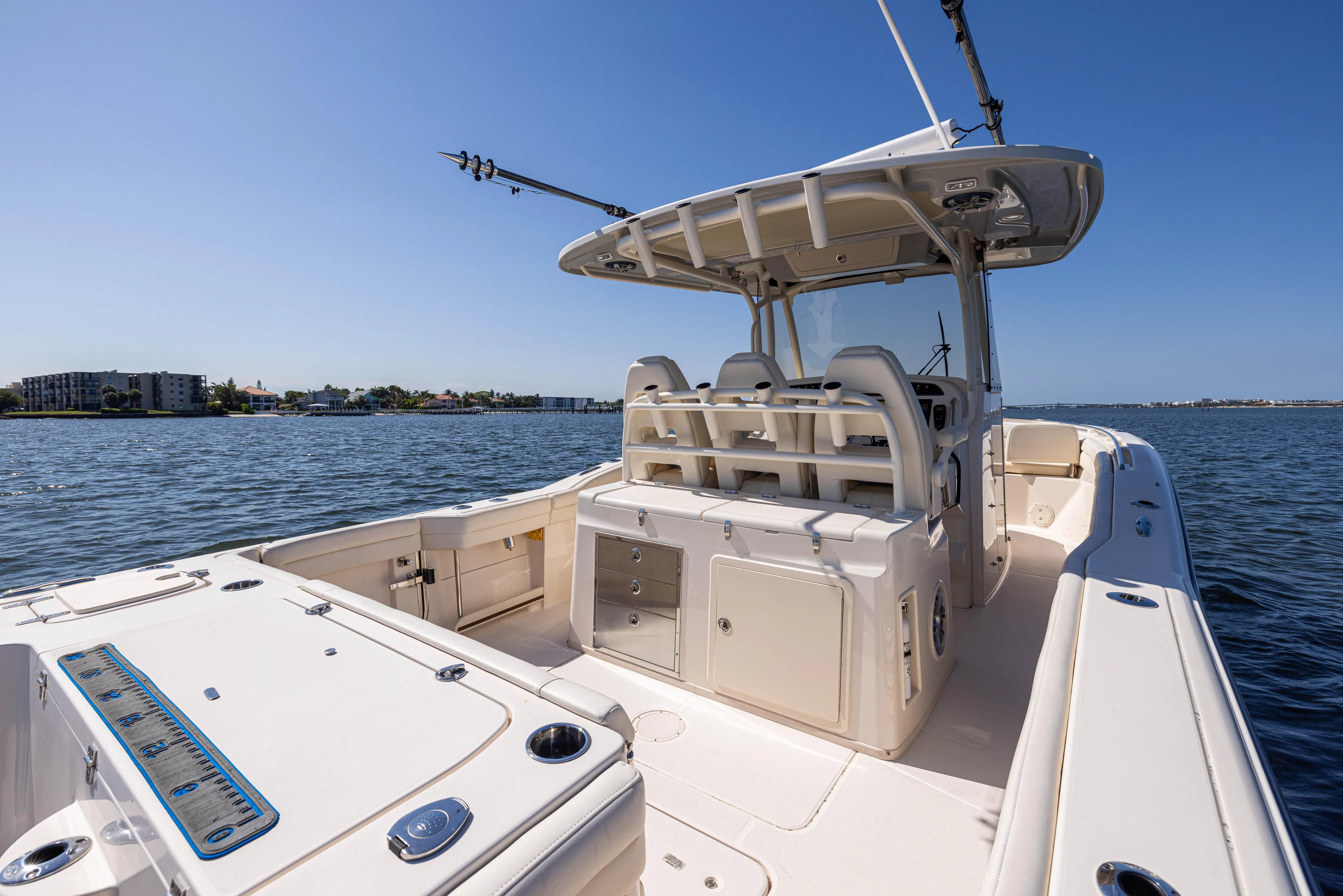 Purple Bags 2 Yacht Photos Pics 2023 Grady-White Canyon 326 boat on water, featuring spacious deck and seating.