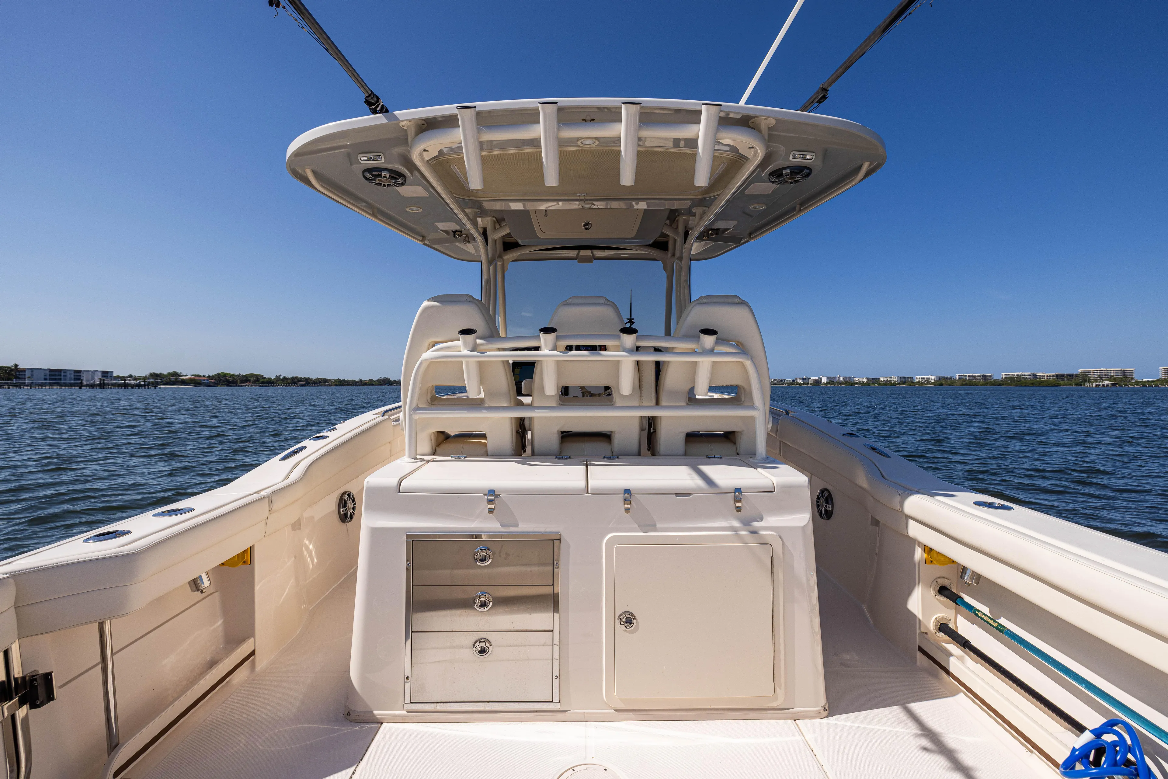 Purple Bags 2 Yacht Photos Pics 2023 Grady-White Canyon 326 boat interior with seating and storage, on a sunny day at sea.