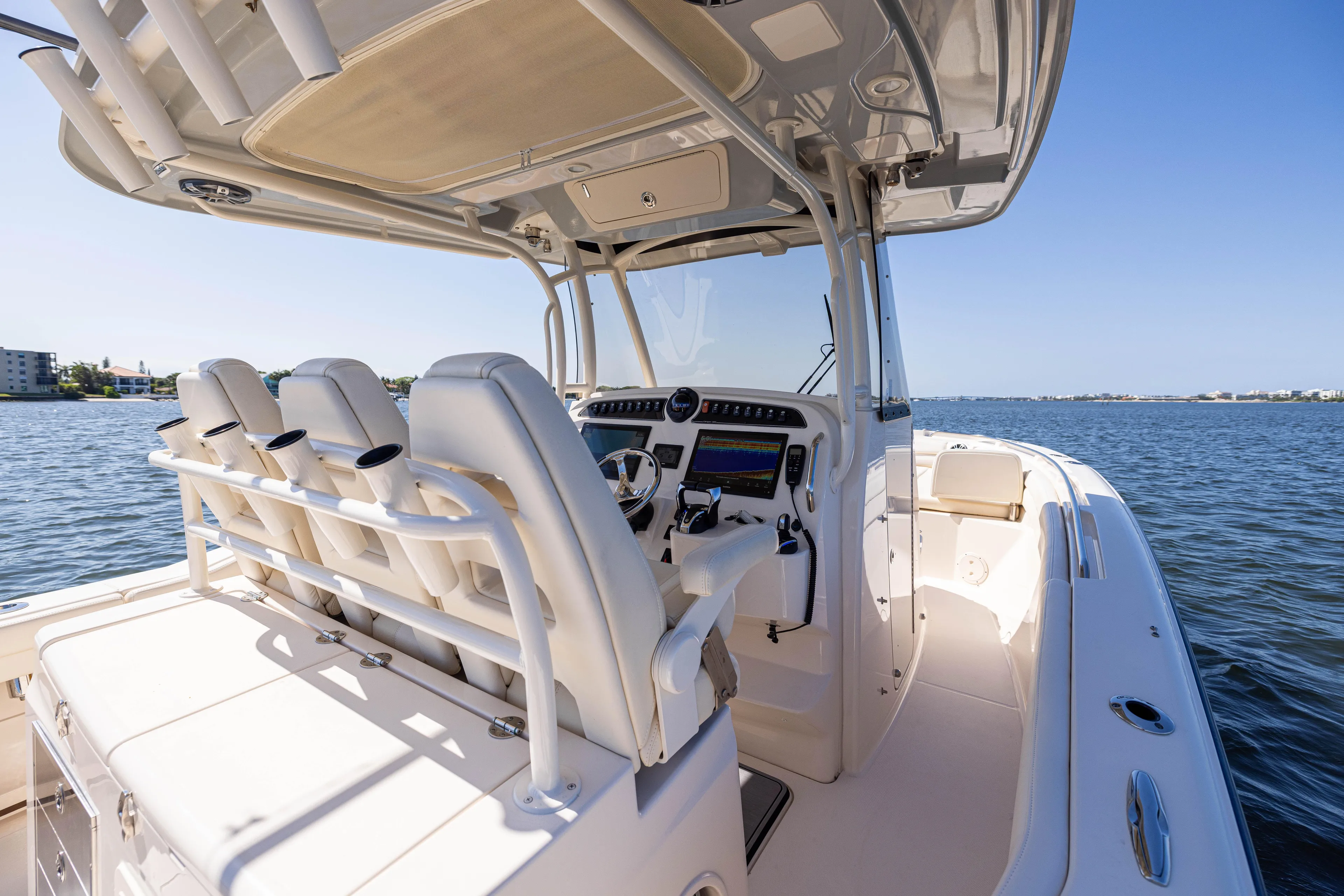 Purple Bags 2 Yacht Photos Pics 2023 Grady-White Canyon 326 boat interior with helm, seats, and ocean view.