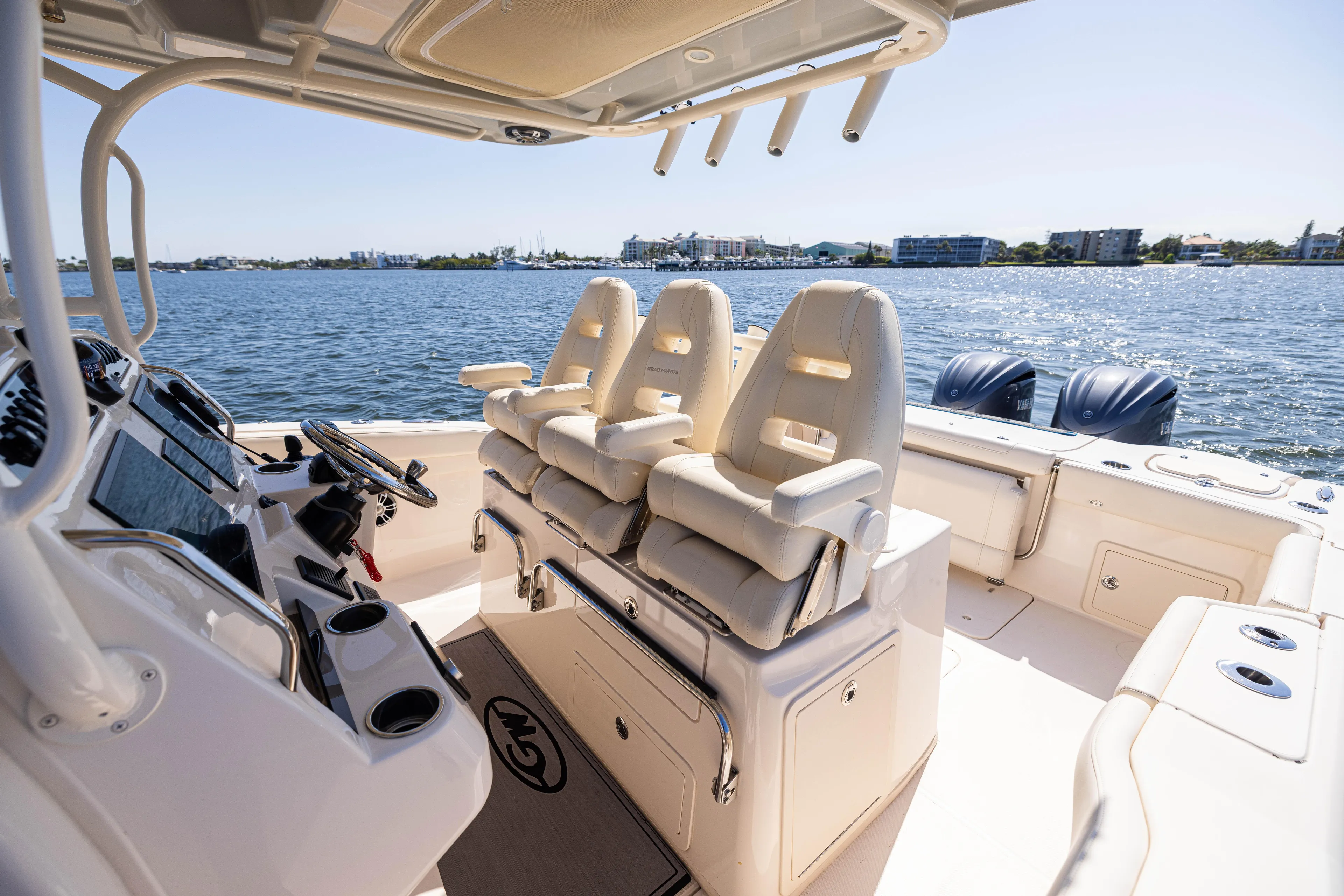 Purple Bags 2 Yacht Photos Pics 2023 Grady-White Canyon 326 boat interior with seating, steering console, and ocean view.