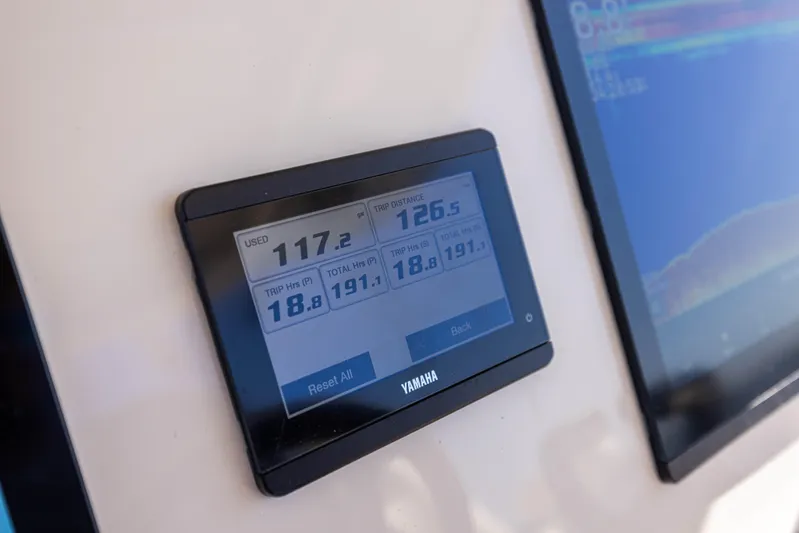 Purple Bags 2 Yacht Photos Pics Yamaha display on 2023 Grady-White Canyon 326 boat dashboard showing performance metrics.