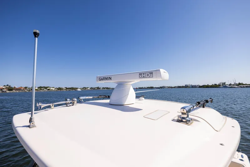 Purple Bags 2 Yacht Photos Pics 2023 Grady-White Canyon 326 boat with Garmin xHD2 radar on calm water.