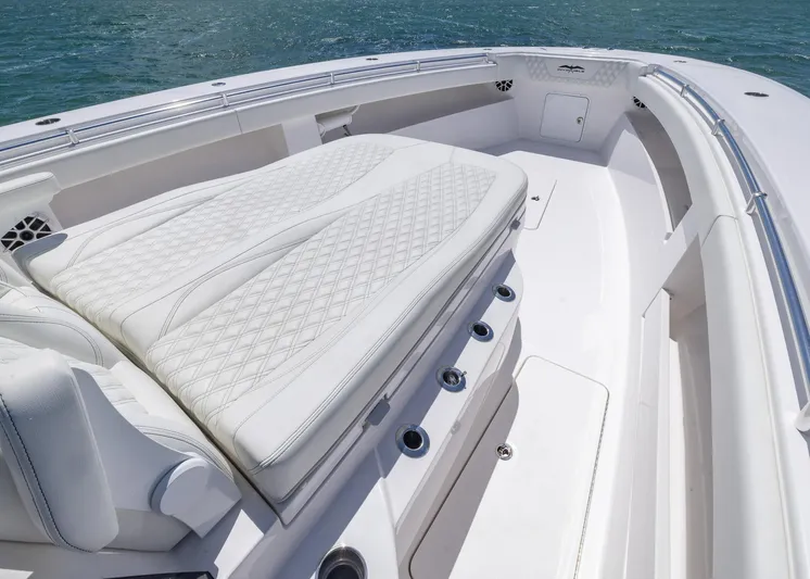  Yacht Photos Pics 2025 Invincible 43 Open Fisherman boat with luxurious white seating and ocean backdrop.