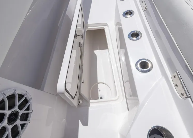  Yacht Photos Pics 2025 Invincible 43 Open Fisherman boat storage compartment and speaker detail.