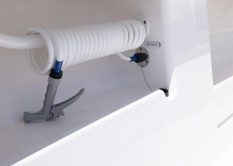  Yacht Photos Pics Coiled hose and nozzle on 2025 Invincible 43 Open Fisherman boat.