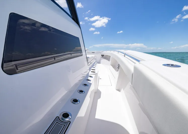  Yacht Photos Pics 2025 Invincible 43 Open Fisherman boat on open sea under clear blue sky.