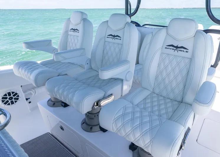  Yacht Photos Pics Luxurious seating on 2025 Invincible 43 Open Fisherman boat with ocean backdrop.