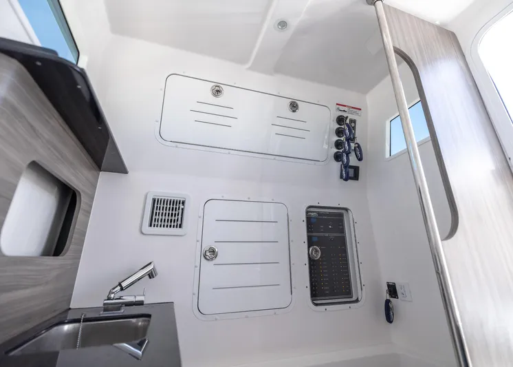  Yacht Photos Pics Interior of 2025 Invincible 43 Open Fisherman boat, featuring control panels and sink.