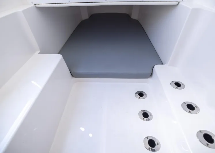  Yacht Photos Pics Interior view of 2025 Invincible 43 Open Fisherman boat, featuring seating and drainage system.