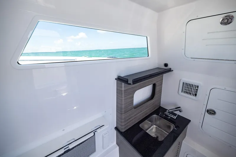  Yacht Photos Pics Interior of 2025 Invincible 43 Open Fisherman boat with sink and ocean view.