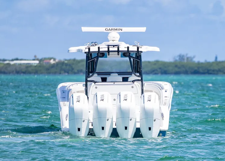  Yacht Photos Pics 2025 Invincible 43 Open Fisherman boat with four engines on the water.