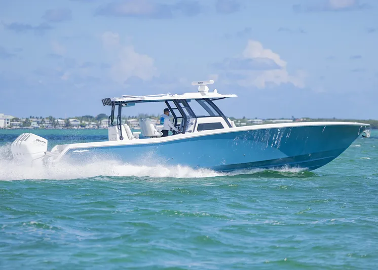  Yacht Photos Pics 2025 Invincible 43 Open Fisherman cruising on the ocean.