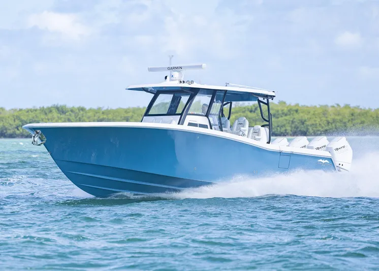  Yacht Photos Pics 2025 Invincible 43 Open Fisherman boat cruising on blue water.