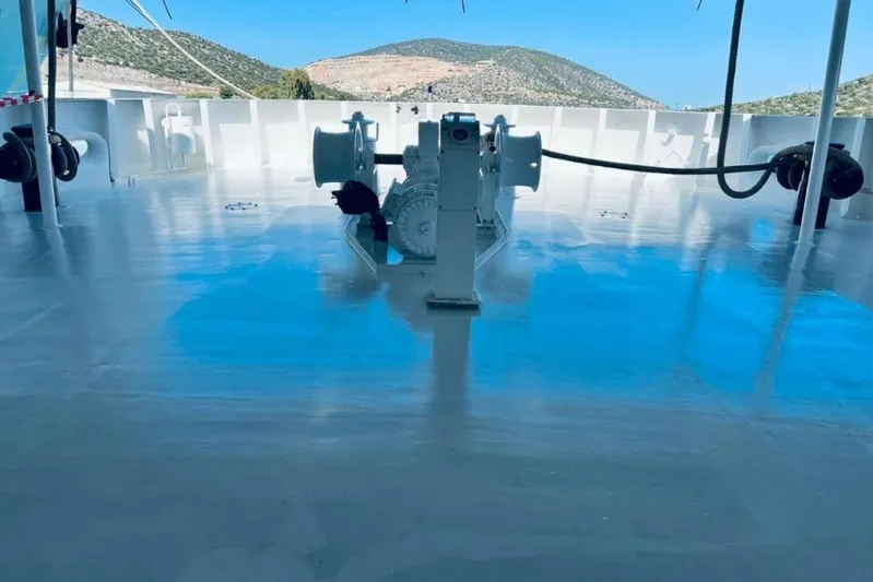  Yacht Photos Pics Deck of 1974 SCHICHAU UNTERWESER AG Expedition Vessel, featuring winch and scenic background.