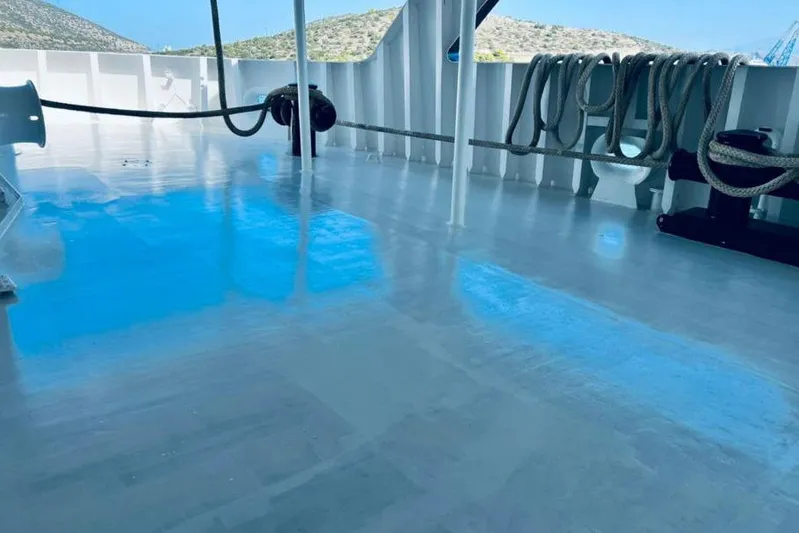  Yacht Photos Pics Shiny deck of 1974 SCHICHAU UNTERWESER AG expedition vessel with ropes and equipment.