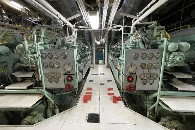  Yacht Photos Pics Engine room of 1974 SCHICHAU UNTERWESER AG Expedition Vessel, featuring control panels and machinery.