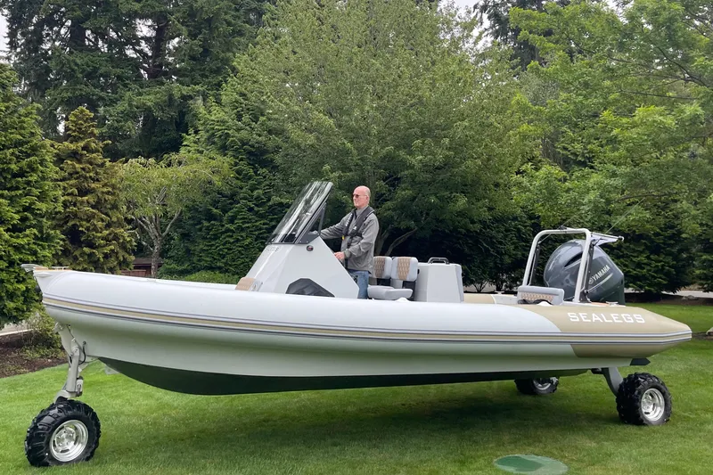  Yacht Photos Pics 2022 Sealegs 7.5M amphibious boat on grass with trees in background.