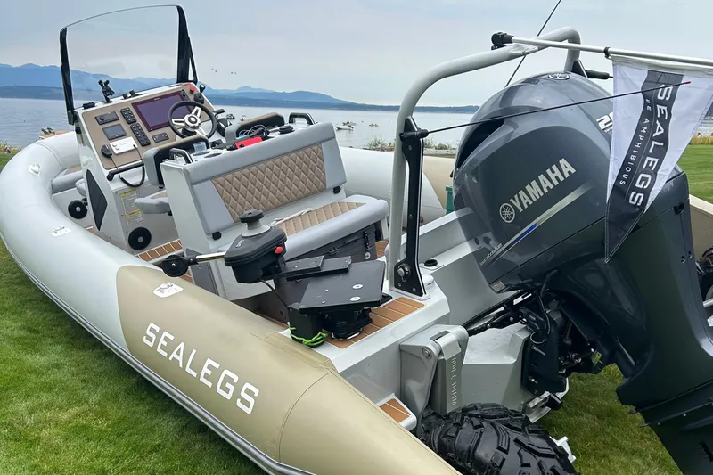  Yacht Photos Pics 2022 Sealegs 7.5M amphibious boat with Yamaha engine on grassy shore.