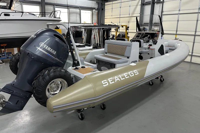  Yacht Photos Pics 2022 Sealegs 7.5M amphibious boat with Yamaha engine in a garage setting.