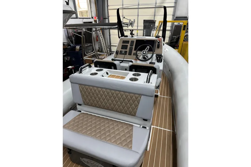  Yacht Photos Pics Interior of a 2022 Sealegs 7.5M boat with quilted seating and modern dashboard.