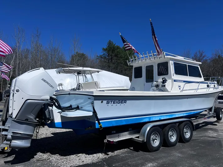  Yacht Photos Pics 2022 Steiger Craft 31 Chesapeake boat on trailer with American flags in background.