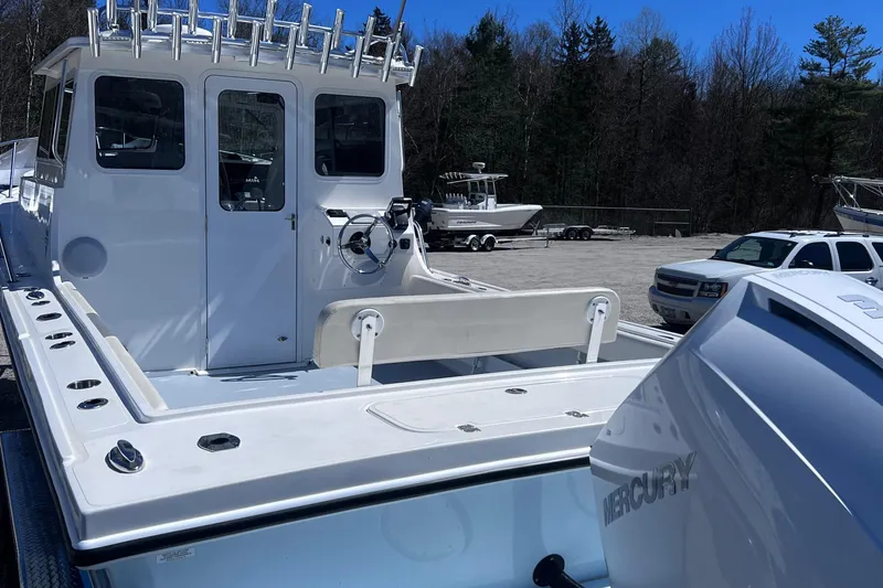  Yacht Photos Pics 2022 Steiger Craft 31 Chesapeake boat with Mercury engine, parked outdoors.