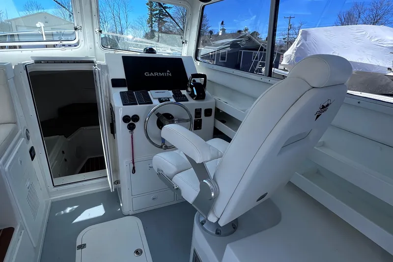  Yacht Photos Pics 2022 Steiger Craft 31 Chesapeake helm with Garmin navigation system and captain's chair.