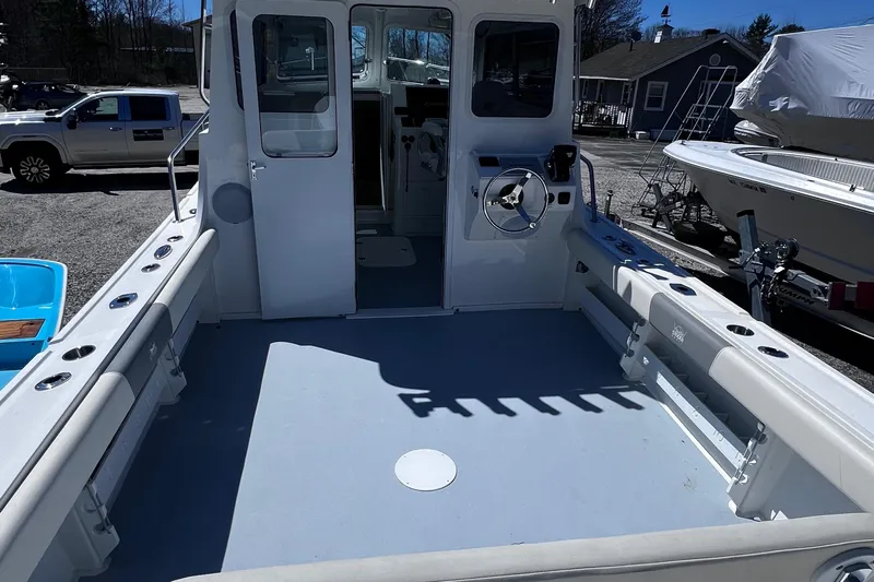  Yacht Photos Pics 2022 Steiger Craft 31 Chesapeake boat deck with steering wheel and seating.