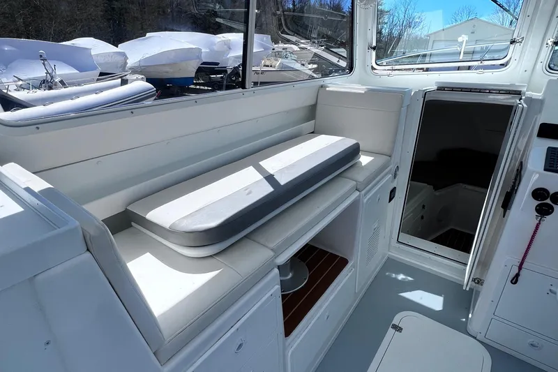  Yacht Photos Pics 2022 Steiger Craft 31 Chesapeake boat interior with seating and storage.