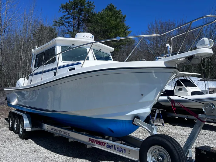  Yacht Photos Pics 2022 Steiger Craft 31 Chesapeake boat on trailer, parked outdoors.