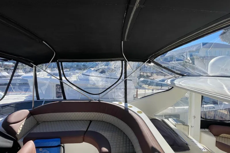 Good Times Yacht Photos Pics Interior view of 2004 Meridian 459 Motoryacht with seating and marina backdrop.